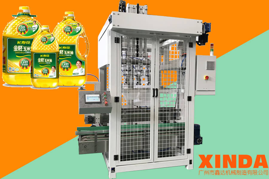 食用油裝箱機,食用油自動夾取式裝箱機-廣州鑫達(dá)機械