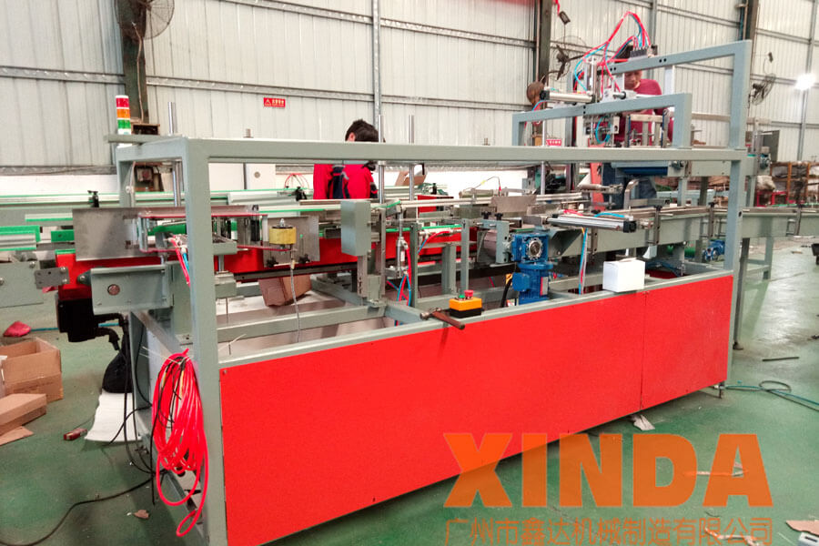 新型小盒子開裝封一體機,自動裝箱機,方盒裝箱機-廣州鑫達(dá)機械